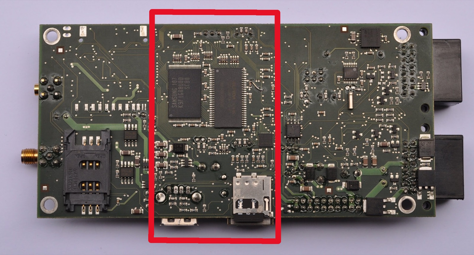 A custom PCB prototype that replaces four separate boards; the embedded Linux computer is marked in red